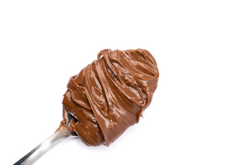 Cream chocolate with spoon on a white background