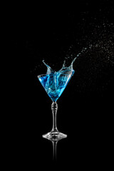 Blue cocktail splash in elegant martini glass captured mid-motion. Concept of energy, clarity, and visual freshness for advertising, branding, and design visuals.