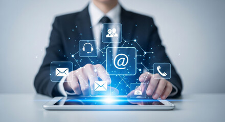 Business person interacting with a digital tablet displaying network of online communication and security icons