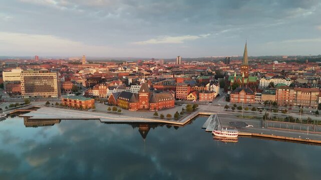 Morning aerial shot of Aarhus old town, Denmark. Skyline of Aarhus with its beautiful buildings and serene waterfront during the golden hour of sunrise