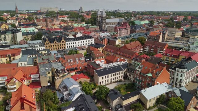 Flying above Lund old town, Sweden. Aerial views of Lund colorful rooftops and historic architecture