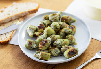 fried baby artichokes on plate
