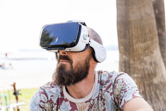 Mature man with virtual reality glasses
