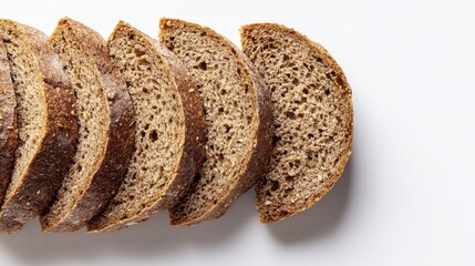 Slices of dark rye bread arranged on white surface for culinary presentation