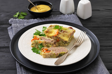 Cheesy ground meat vegetables casserole on a plate