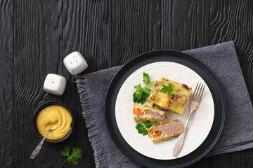 Cheesy ground meat vegetables casserole on a plate