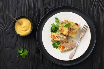 Cheesy ground meat vegetables casserole on a plate