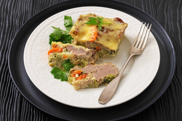 Cheesy ground meat vegetables casserole on a plate