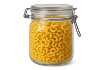 Uncooked elbow macaroni pasta filling glass storage jar