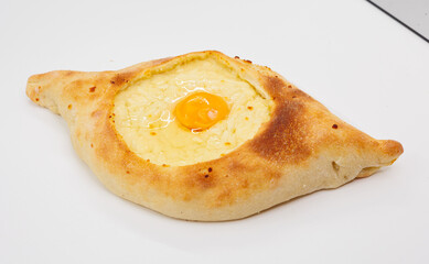 Fresh Baked Adjarian Khachapuri With Egg In Boat-Shaped Bread, Cheese Filling And Golden Yolk
