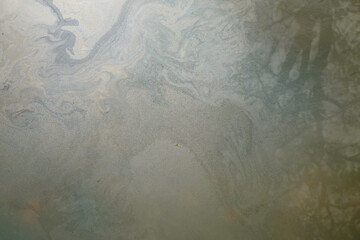 Abstract textured background of oily river water surface.Ecology and environmental concept. Water pollution. For graphic design, banners and 3D rendering