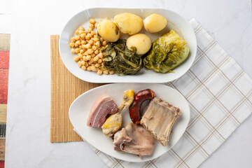 Spanish cocido stew ingredients preparing traditional meal