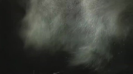 Heavy snow flurry storm blowing fast in dark night winter background