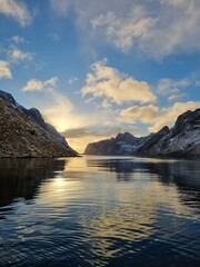 Panoramic view from tourist viewpoint to Reinefjorden with mountains on background at sunrise - Reine, Lofoten Islands, Norway
