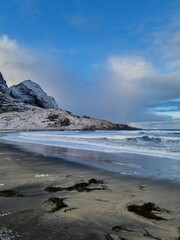 Scenic view of the winter  landscapes at Bunes Beach on a  with the mountains in the background on Lofoten Islands in Norway.
