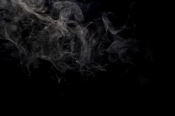 Abstract smoke rising gracefully, creating a dark and dramatic background.