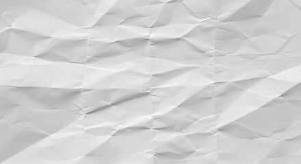 Obraz premium Crumpled white paper with visible creases and folds