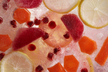 Various fruits in ice. Cold drink.