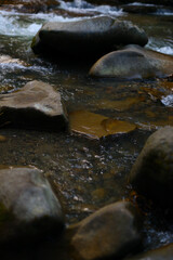 Serene rocky creek with flowing water and natural surroundings