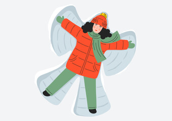 Happy woman making snow angel. Winter season mood.