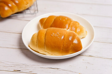(Shio Pan) Japanese style salt bread that is characterized by its crispy exterior and soft, buttery interior.