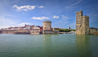 Panoramic view of the iconic entrance to the Vieux Port of La Rochelle, France. Panorama of all...