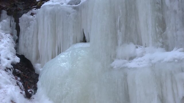 Thick Ice Formations Of Eben Ice Caves In Michigan, United States. Close-up Shot