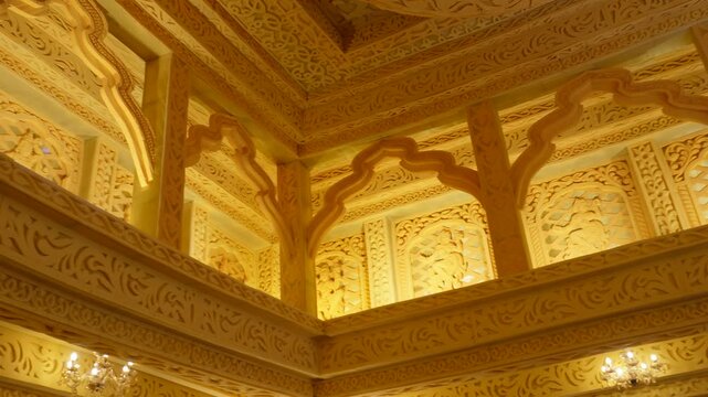 interior with intricate carvings and arches, characteristic of traditional Indian or Moorish architecture