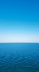 Fototapeta premium Vast Blue Ocean Meets Clear Horizon Under Endless Sky.