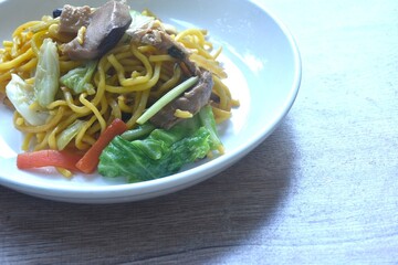 fried yakisoba noodles and cabbage with mushroom vegetarian food on plate