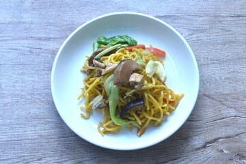 fried yakisoba noodles and cabbage with mushroom vegetarian food on plate