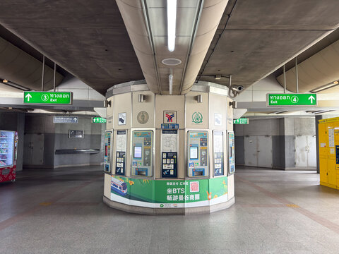 Bangkok, Thailand - July 26, 2025: BTS Skytrain ticket machines and exit signs inside elevated station Bangkok