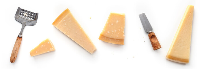 Parmesan cheese wedges, isolated on a white background, overhead flat lay shot with a cheese grater...