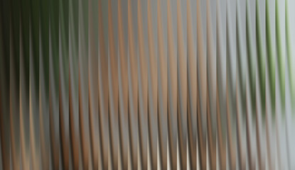 A close-up shot of a textured, rippled surface, creating an abstract and visually captivating pattern. The lines have a sleek appearance and a mesmerizing rhythm