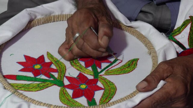 A person doing Kantha embroidery a traditional embroidery from the Bengal India