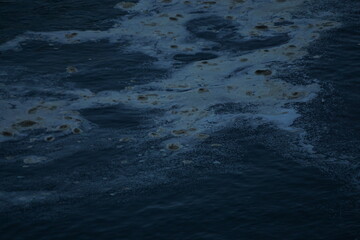 Environmental Threat: A stark depiction of an oil spill polluting the ocean's surface, reflecting a critical environmental issue and its impact. 