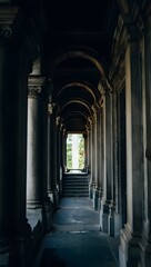 Obraz premium Architectural corridor with columns and arches leading to a bright outdoor space area view
