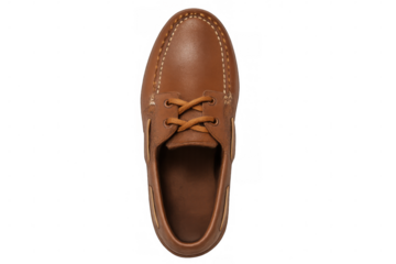 Brown leather classic boat shoe or moccasin style footwear isolated on a transparent background, viewing from above