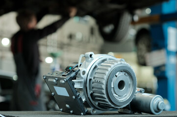 Car service center. New rear axle gearbox. On the car mechanic's desktop. Preparing to replace a...