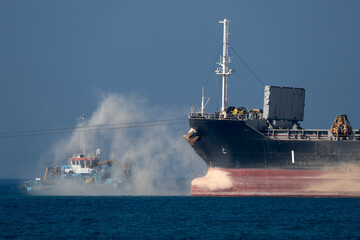Ships working building genoa new breakwater in front of the harbor