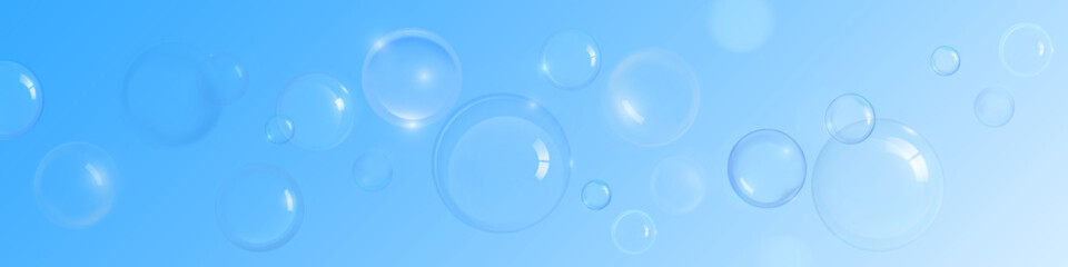 Soap or shampoo bubble background with transparent spheres and light reflections on soft blue gradient. Floating clean foam elements of various sizes in horizontal composition. Fresh hygiene theme.