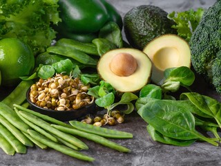 Green Healthy Foods with Avocado, Sprouts, and Fresh Vegetables