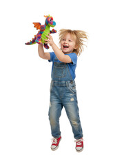 Happy child holding a colorful dragon toy on a transparent background