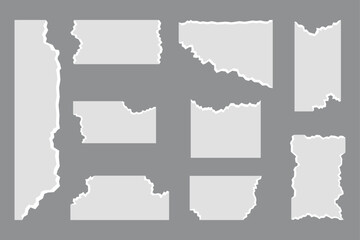 Set of Nine Torn Paper Pieces on Gray Background ripped