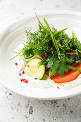 Gourmet fish salad with shredded beets and microgreens served in a white bowl on a restaurant table. Elegant plating, vibrant colors, fine dining atmosphere.