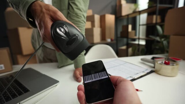 A man is using a qr code reader to scan a code on a phone