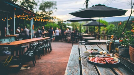 Evening social gathering with gourmet food outdoor restaurant relaxed atmosphere scenic view culinary delight