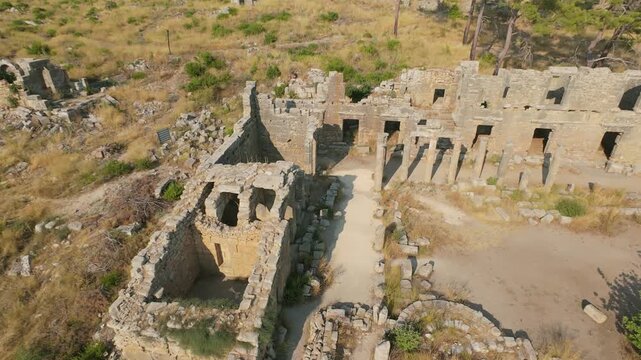 Aerial fpv drone footage flying through the ancient city ruins of Lyrbe, Antalya, Turkey