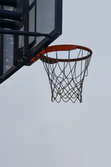 basketball net board hoop. Outdoor sports ground Basketball Shield isolated on blue sky background. Home yard with basketball court. Active healthy games. Beautiful autumn fall season park landscape