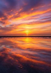 Obraz premium Spectacular sunrise reflecting on wet sand, creating a mesmerizing visual effect